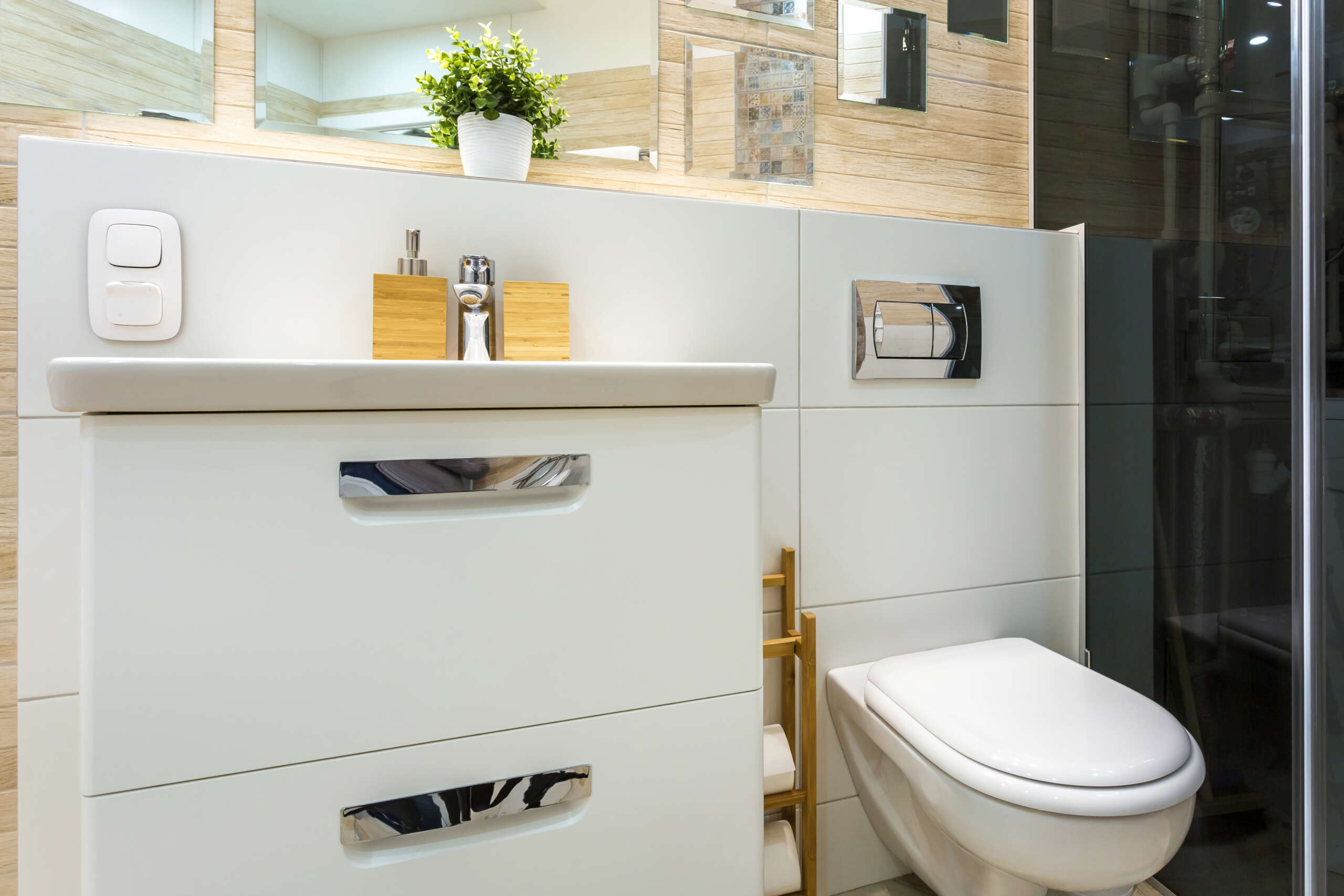 MINSK, BELARUS - toilet and detail of a corner shower cabin with wall mount shower attachment